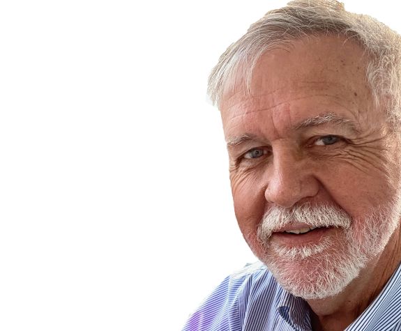 A man smiles for a photo 