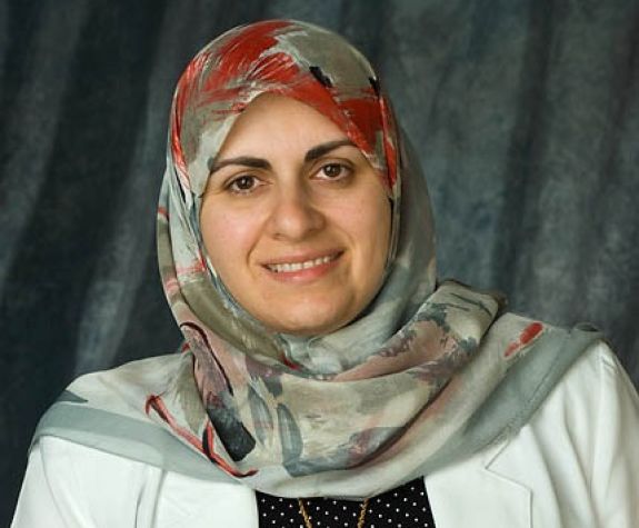 The photo shows the smiling face of Dr. Nassrine Noureddine.