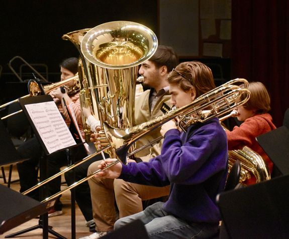 Brass students playing trombone and tuba
