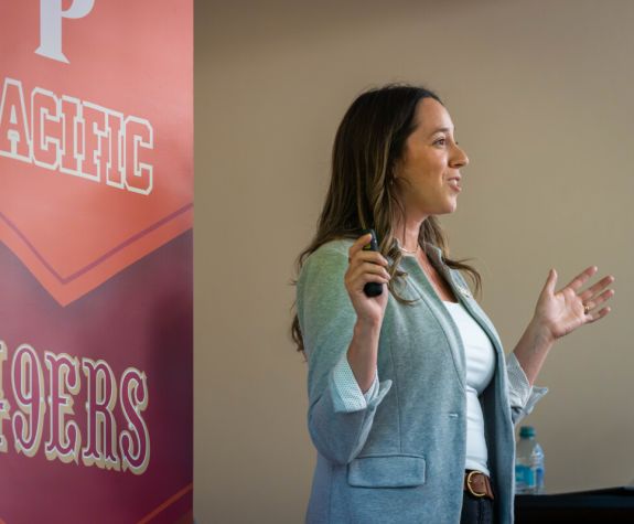 San Francisco 49ers Senior Director of People Operations Emily Bird speaks to a Pacific class
