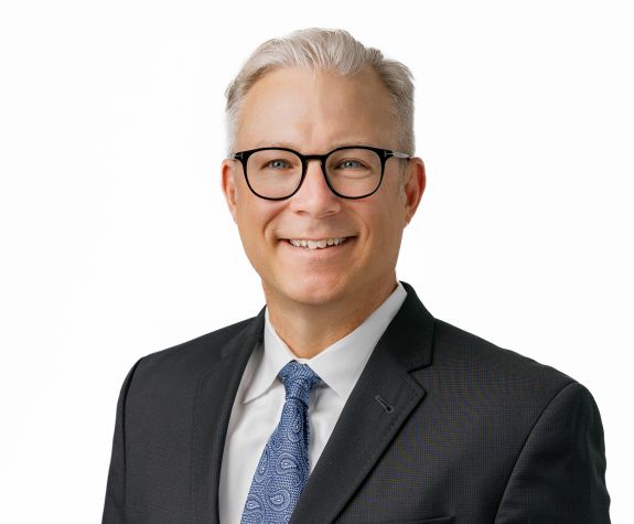 A portrait of a man wearing a suit