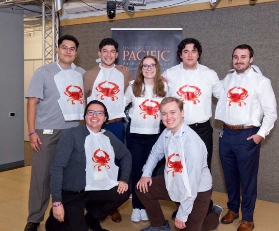 group of people wearing crab shirts