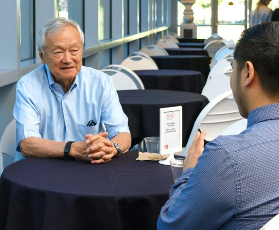 Norman Kobayashi ’70, ’73 with graduate student at scholarship recognition event