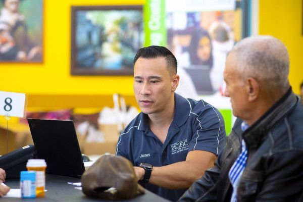 PharmD student with a patient at a Medicare Part D Outreach Clinic