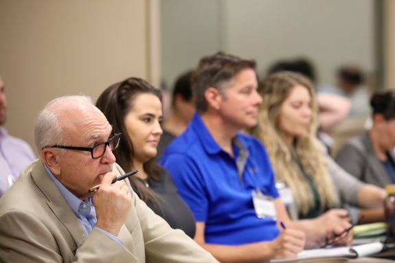 Students listening attentively.