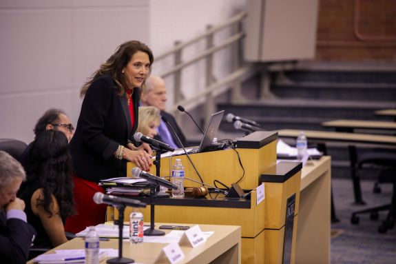 Judge communicating information to the audience.