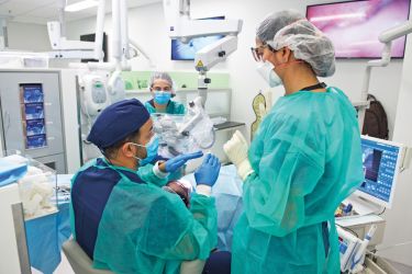 gowned people in clinic