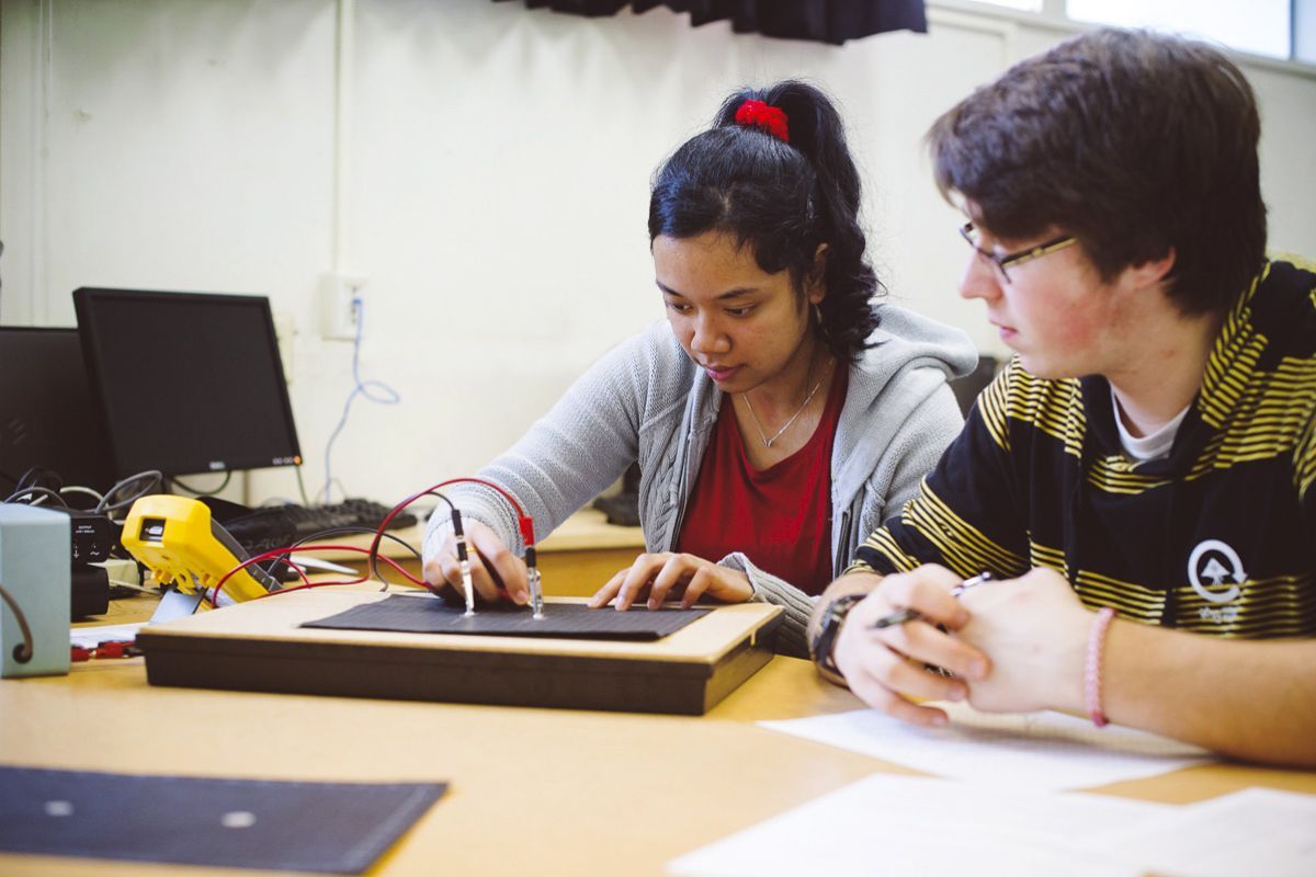 physics students studying in laboratory
