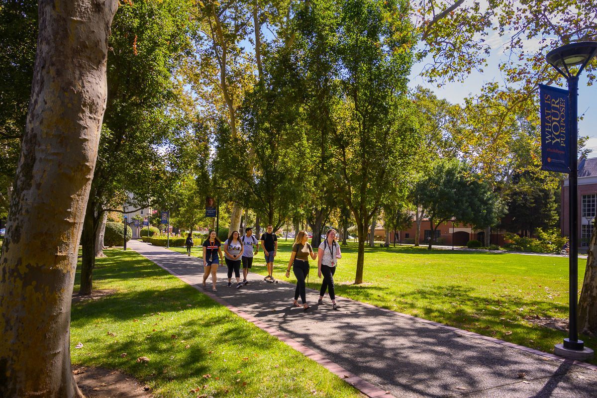 students walk on campus