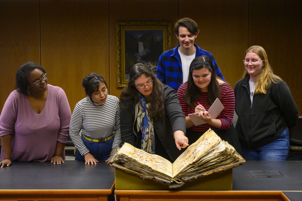 music history professor and students in library