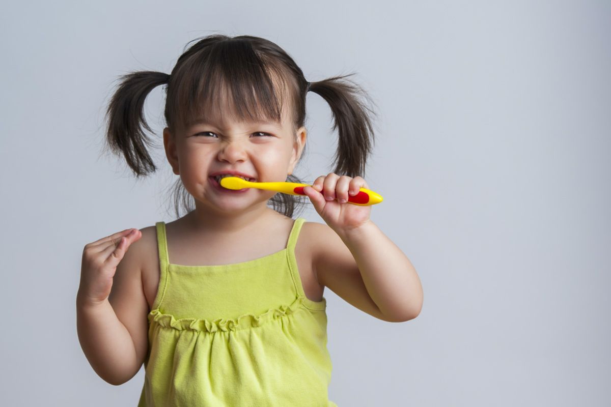 girl with toothbrush