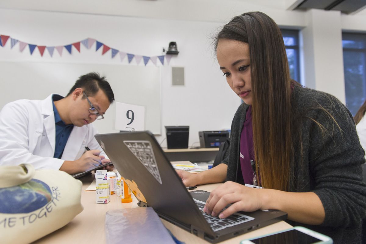 student in front of a laptop