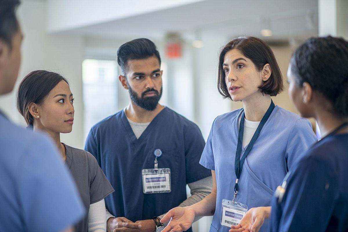 healthcare professionals talking in a group