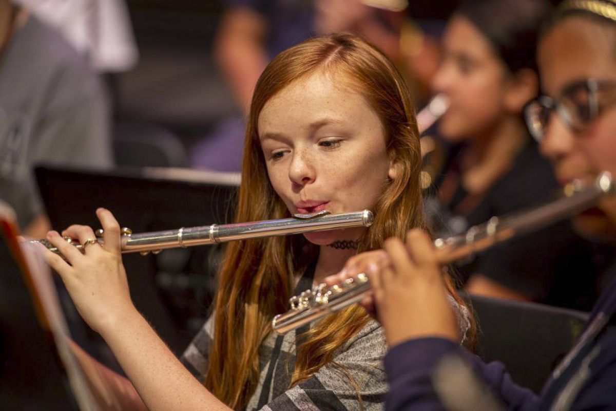 a music camp student playing the flute