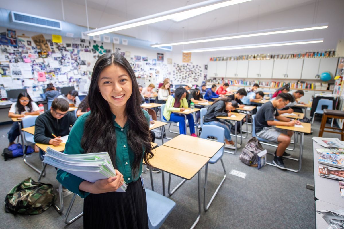 Teaching student in a high school classroom
