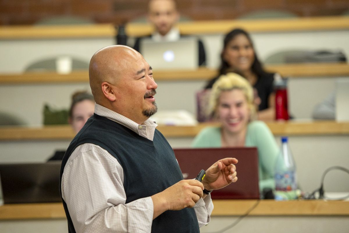 A professor addresses a classroom