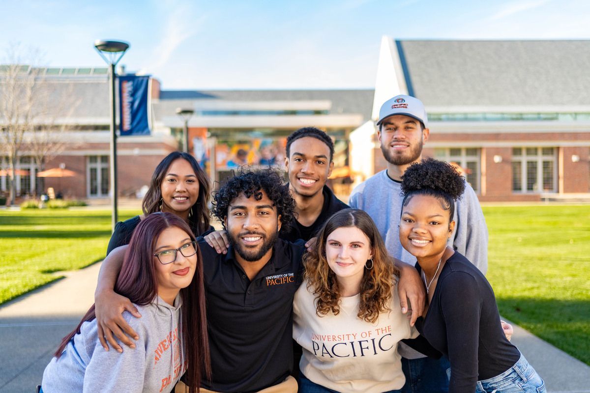 A group of students wearing Pacific gear outside the DUC