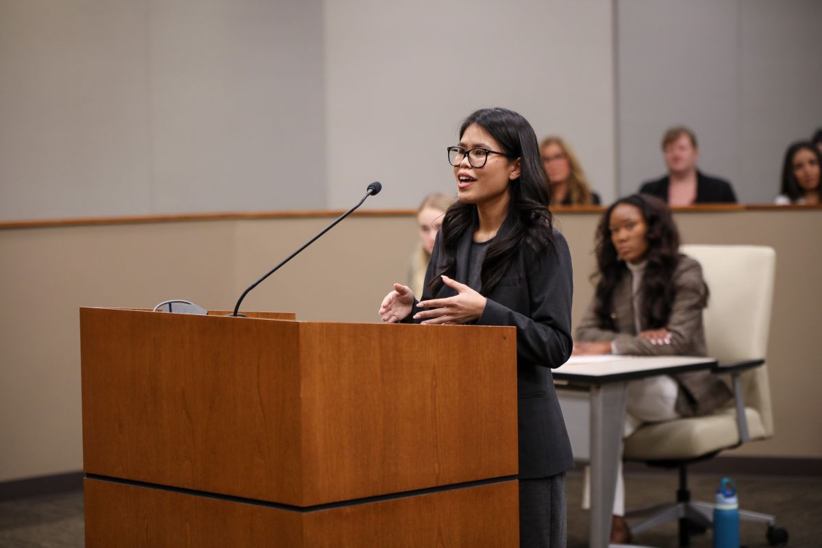 Student standing at podium