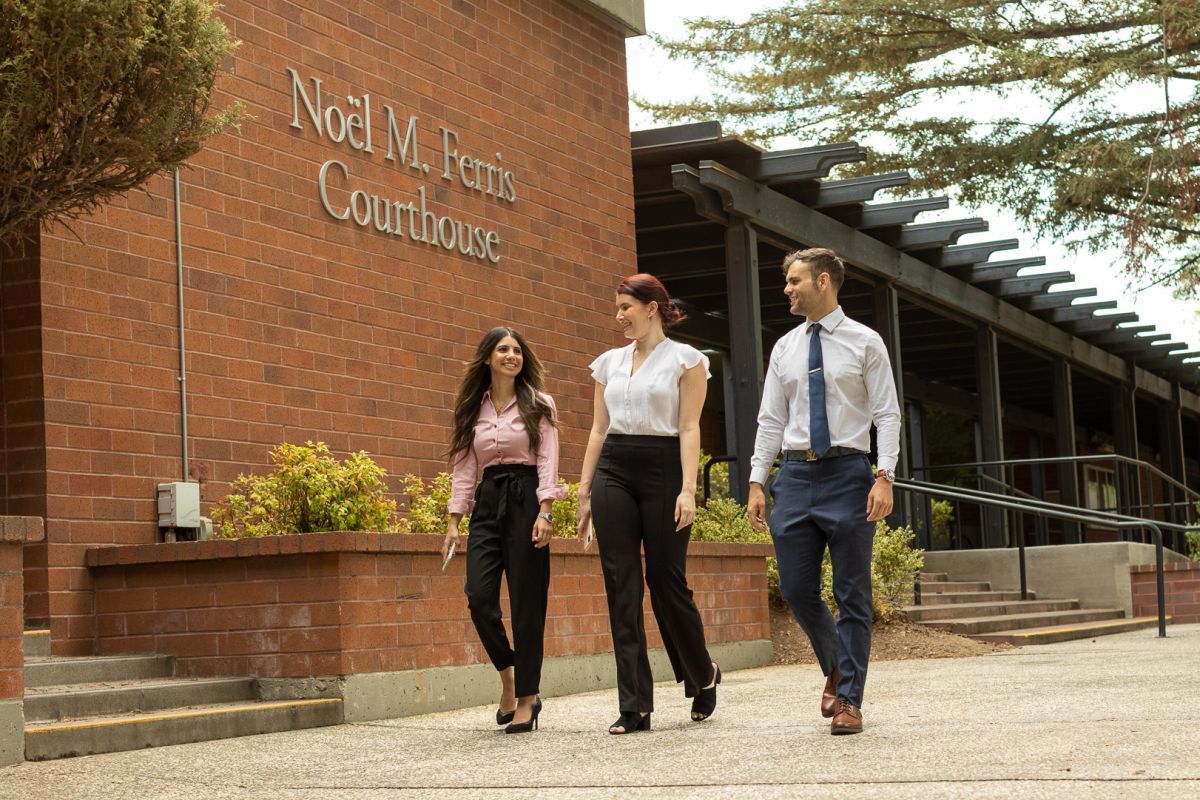 three students walking on campus