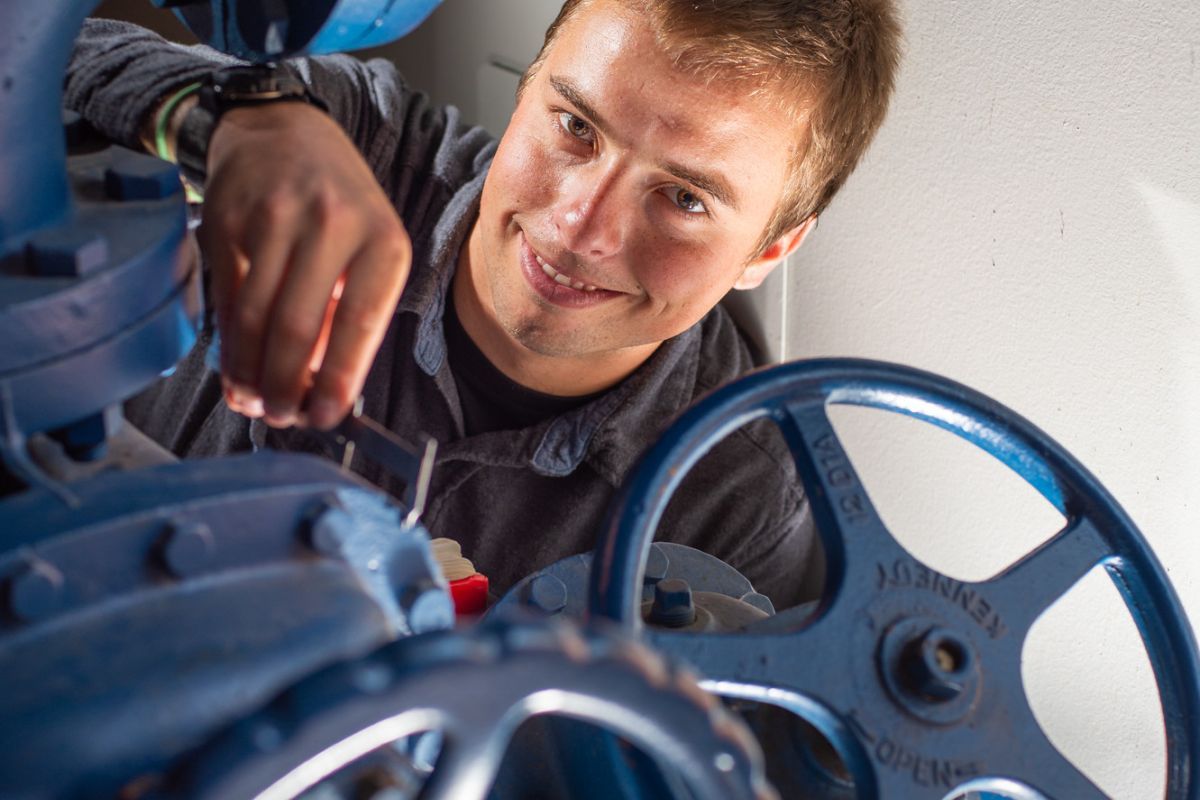 Student turning wheels