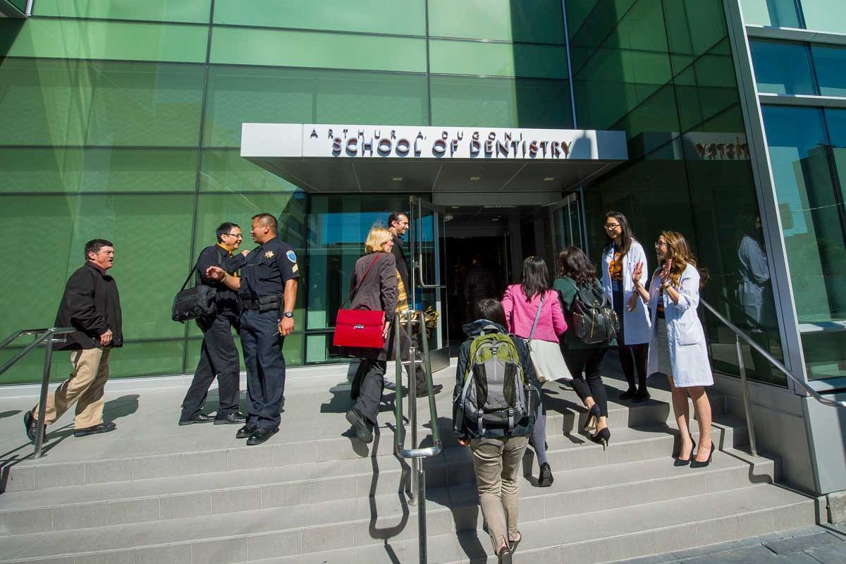 students, staff and faculty at entrance to San Francisco campus