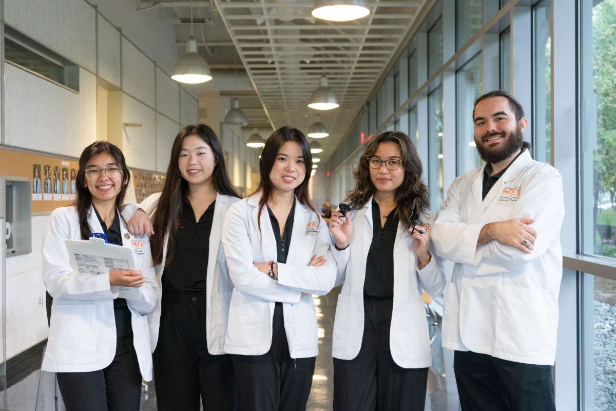 A group of students in white coats.