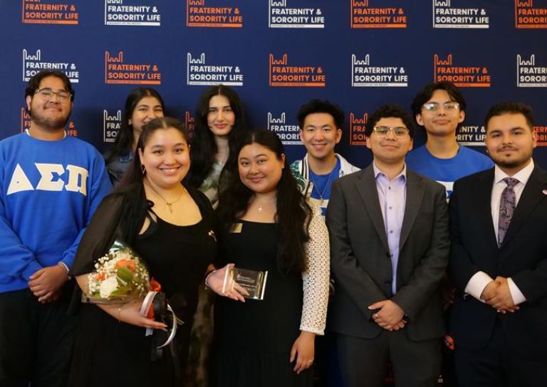 Photo of students in front of FSL backdrop