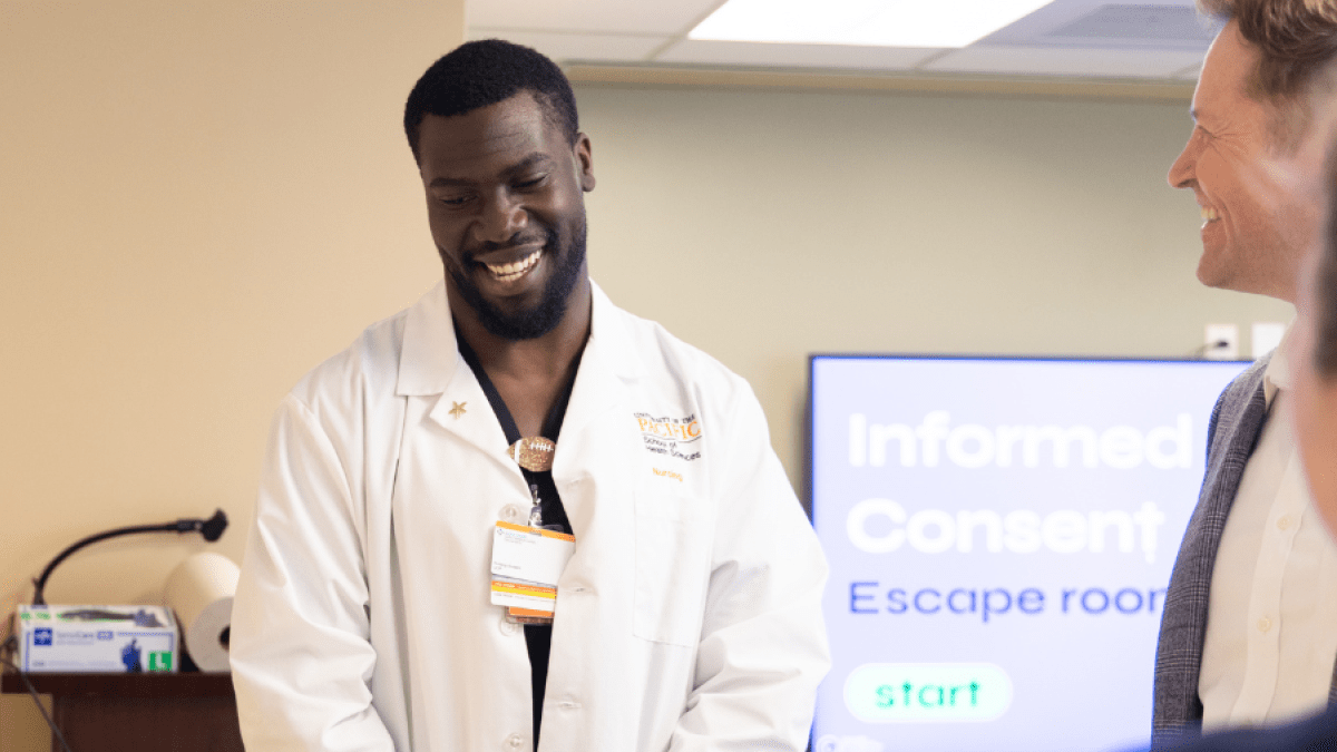 Nursing student in white lab coat