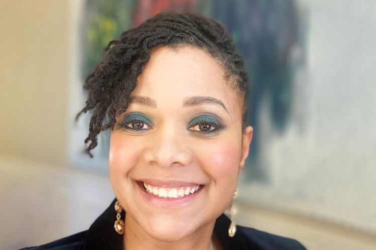 A close up picture of a woman with short hair