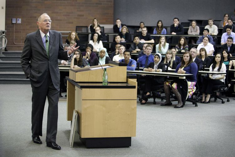 A man teaches in a classroom 