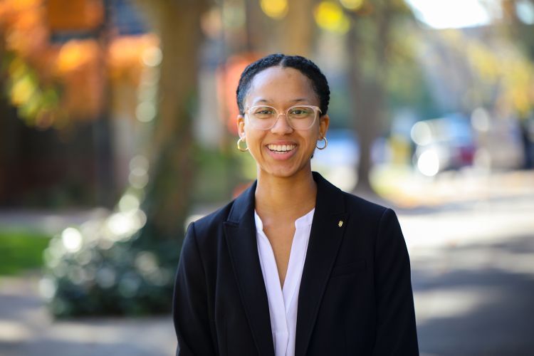 A law student poses for a photo.