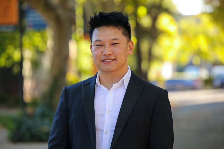 A law student poses for a photo.