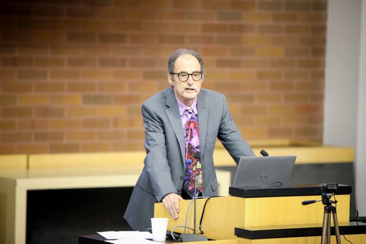 Professor at podium.