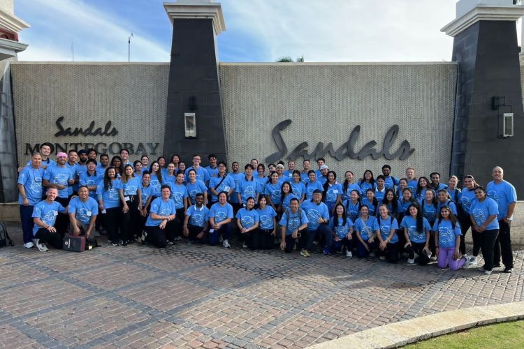 70 people in front of Sandals Resort in Montego Bay Jamaica
