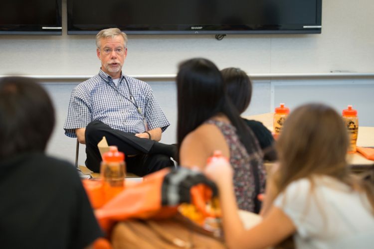 John C. Livesey, PhD with a students in a classroom
