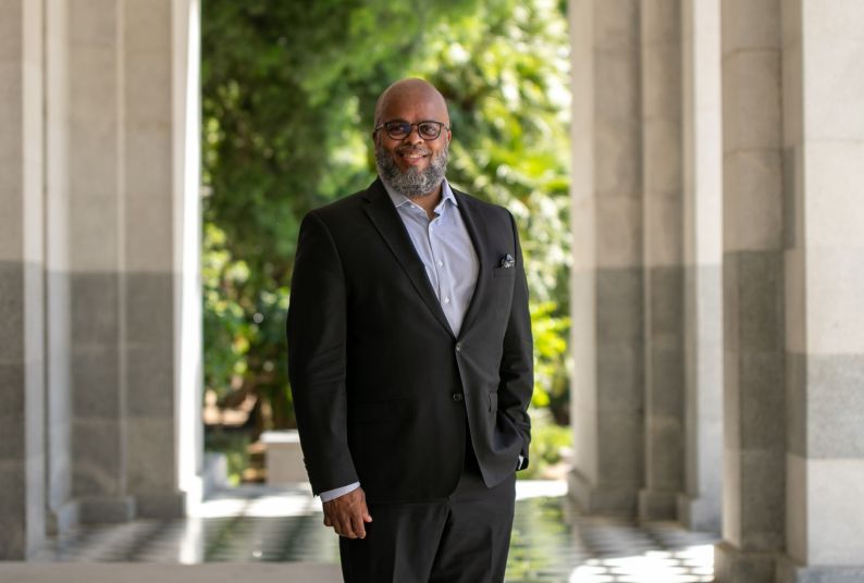 A portrait of a man wearing a suit