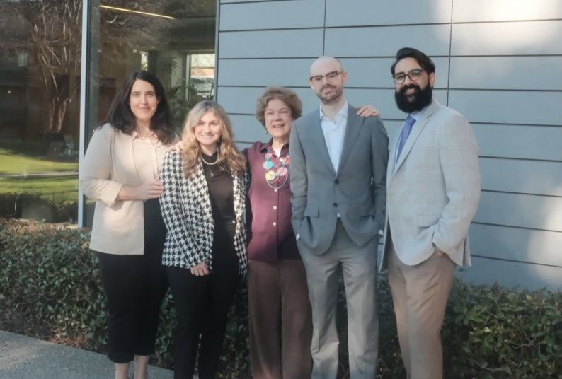 A group of five people outside