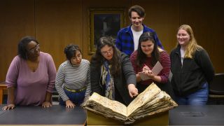 music history professor and students in library