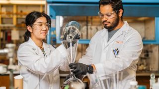 Two students working in a research lab